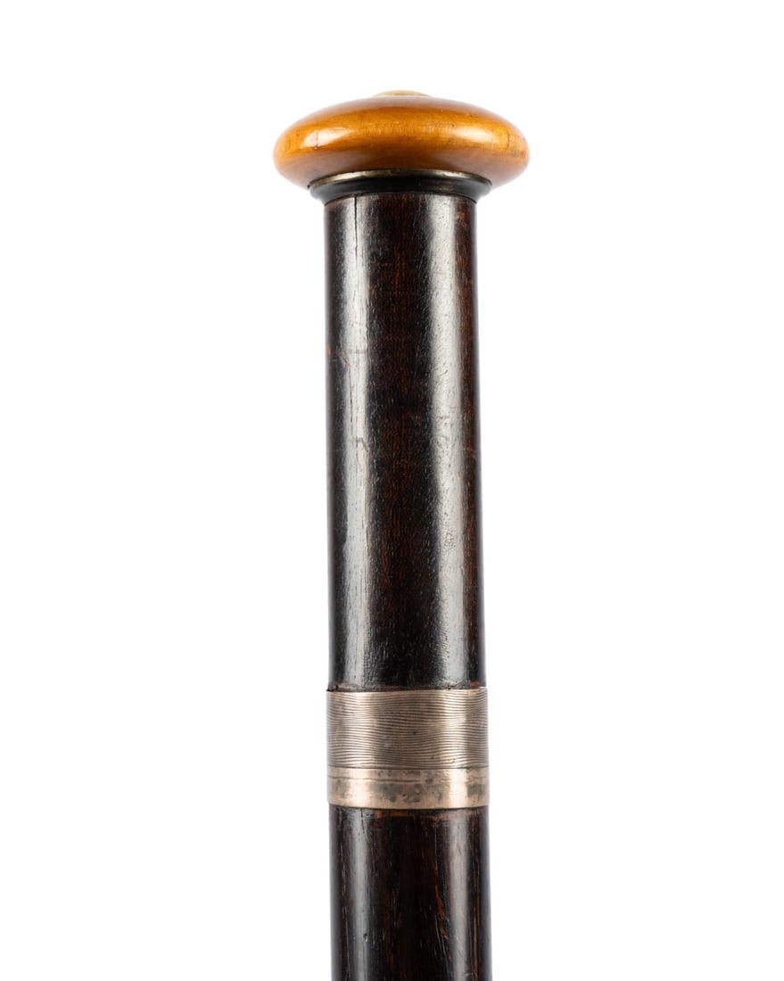 20TH C. ENGLISH WALKING CANE W/ DOCUMENT IN HANDLE: English,Birmingham 1926. Walking cane with a flat wooden knob handle supported by a silver collar, dark-stained tapered shaft with horn ferrule; the top unscrews to reveal a freedom document to