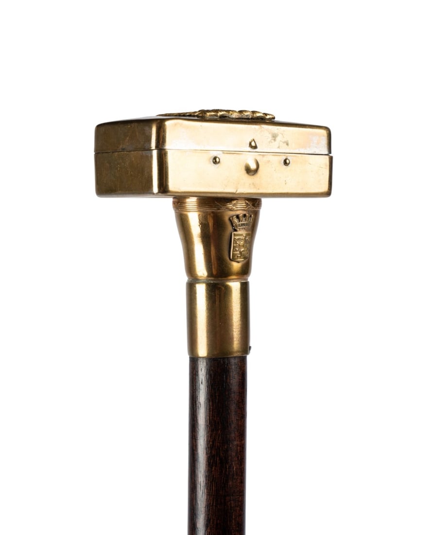 AMERICAN TRAVELER'S GADGET CANE, C. 1910: American, circa 1910. Traveling salesman?s gadget cane with a brass eagle box handle containing a vintage razor handle and Gillette blades, brass collar, dark stained hardwood shaft, and horn