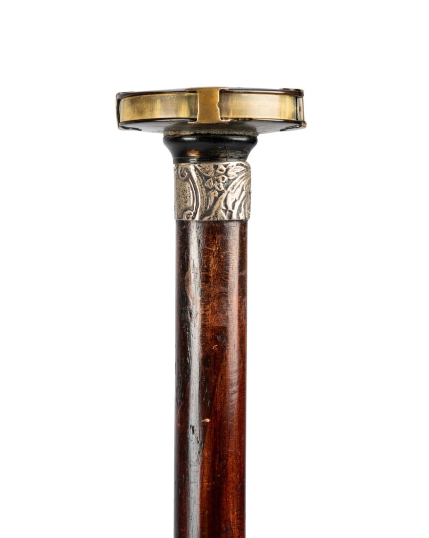 ENGLISH MAGNIFYING GLASS GADGET CANE, C. 1900: English, circa 1900. Walking cane with horn handle sliding out to reveal magnifying glass, mounted on etched silver collar with marks, with dark-stained exotic wood shaft terminating in metal