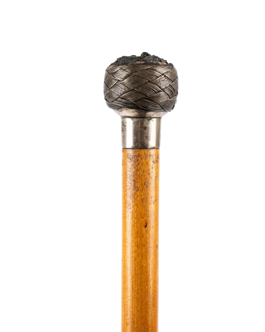 ENGLISH WOVEN GADGET WALKING CANE, C. 1860: English, circa 1860. Walking cane with woven silver top handle unscrewing to reveal hidden pen, silver collar with English hallmarks, maple shaft, and horn ferrule. Approximate measurements: length: