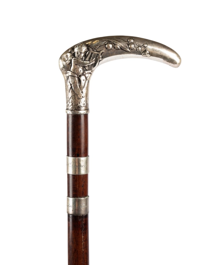 CIVIL WAR GENERAL WILLIAM DRAPER PRESENTATION CANE: American, circa 1900. Walking cane with silver handle marked 800, decorated with florals and putti, without collar, with two engraved silver rings below the handle reading "General Draper" and "Hopeda