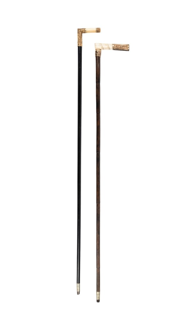 TWO GILT & BONE HANDLE WALKING CANES, C. 1905: American / English, circa 1905. Two walking canes, one with gilt and bone handle engraved "F.R.R. 1906," with notched stained hardwood shaft terminating in a metal ferrule, the other with gilt and bon