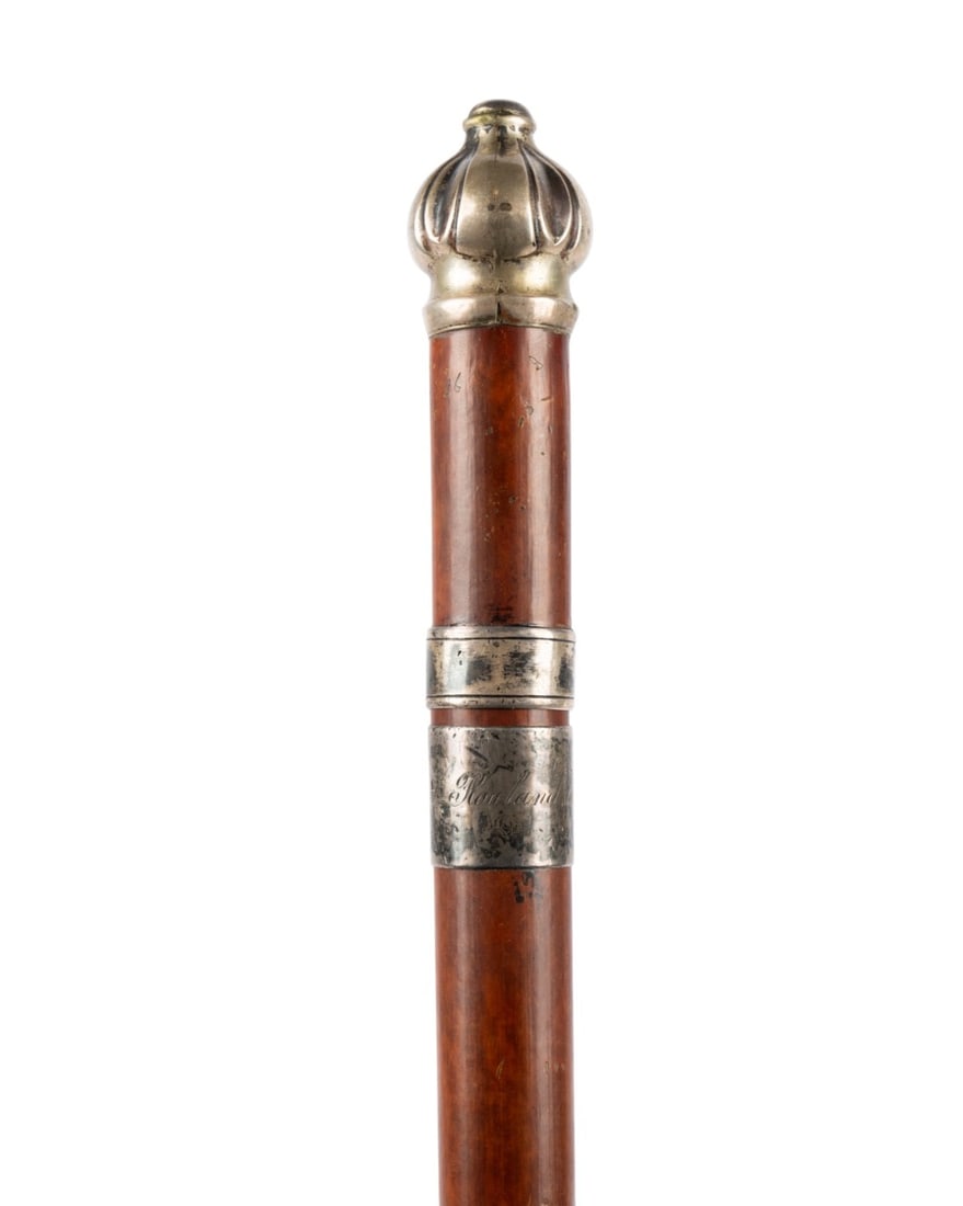 19TH C. AMERICAN CROWN HANDLED PRESENTATION CANE: American, circa 1890. Walking cane with stylized crown knob handle, silver collar, and engraved plaque reading "Rowland C. Stephens," with nicely stained hardwood shaft, and no ferrule. Approximate me