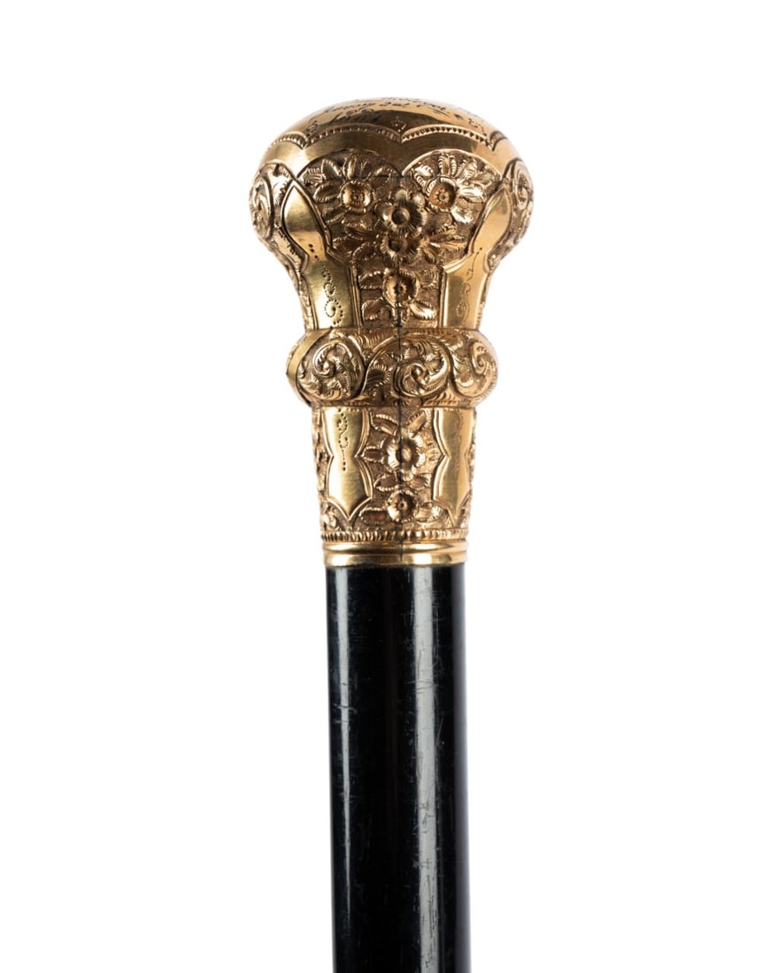 AMERICAN GILT HANDLED PRESENTATION CANE, 1889: American, 1889. Walking cane with ornate gilt handle with repeating patterns, flowers, and scrollwork, engraved at the top "Presented By The Members of The Andrew Johnson Lodge No.433, FLT, 10OF, Morr