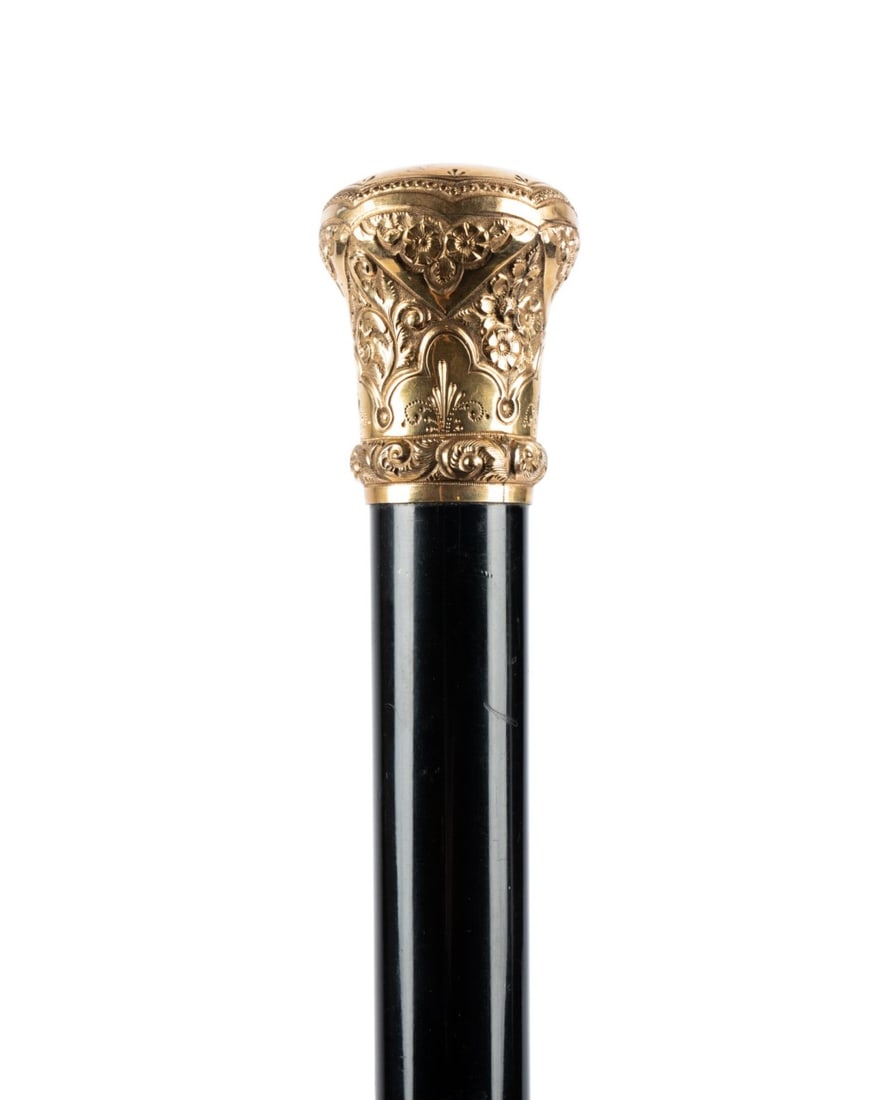 19TH C. AMERICAN GILT DOME PRESENTATION CANE: American, circa 1890. Walking cane with gilt dome handle with botanicals and lines in repeating patterns, engraved at the top "Grandpa, from Louise B. Hutton, 1890," with ebonized hardwood shaft termi