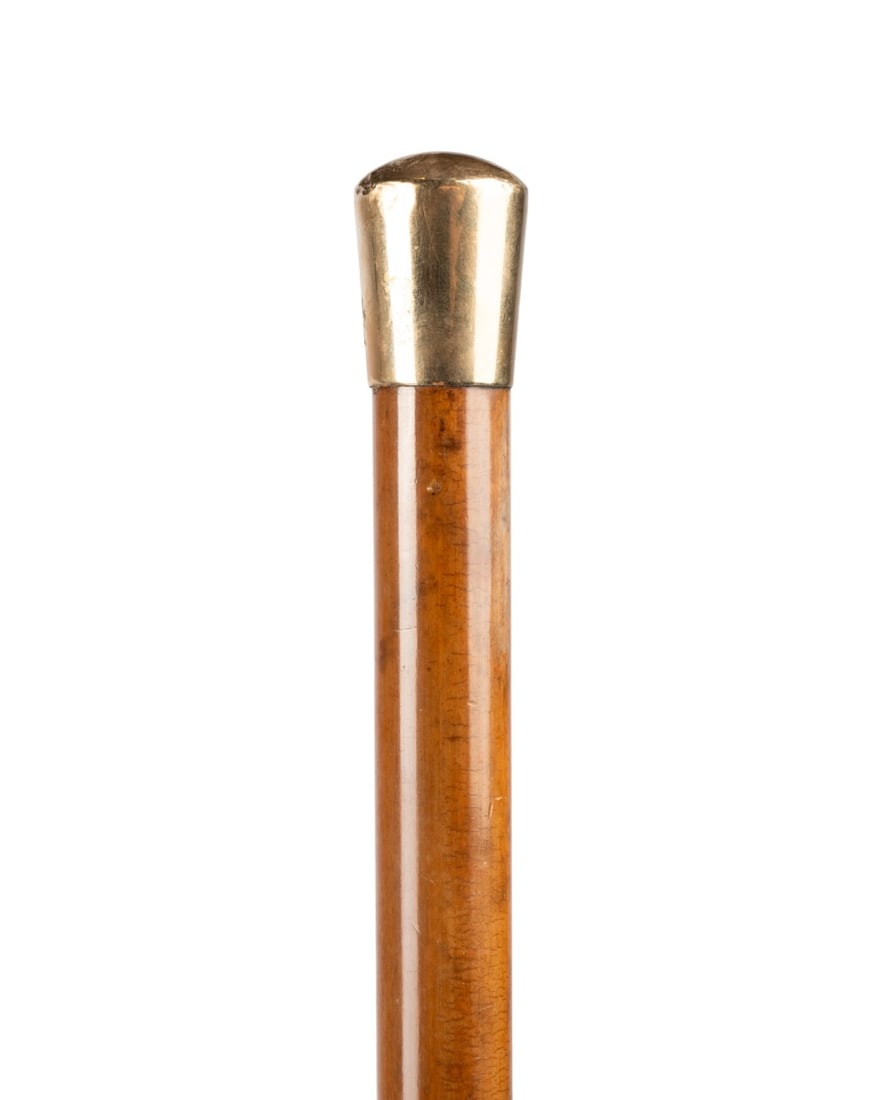 ENGLISH 9K YELLOW GOLD GENTLEMAN'S CANE: English, circa 1890. Victorian walking cane with 9k gold knob handle stamped ?375? and ?HMC,? connecting directly to Malacca wood shaft, with bone ferrule. Approximate measurements: handle: 1.5"; leng