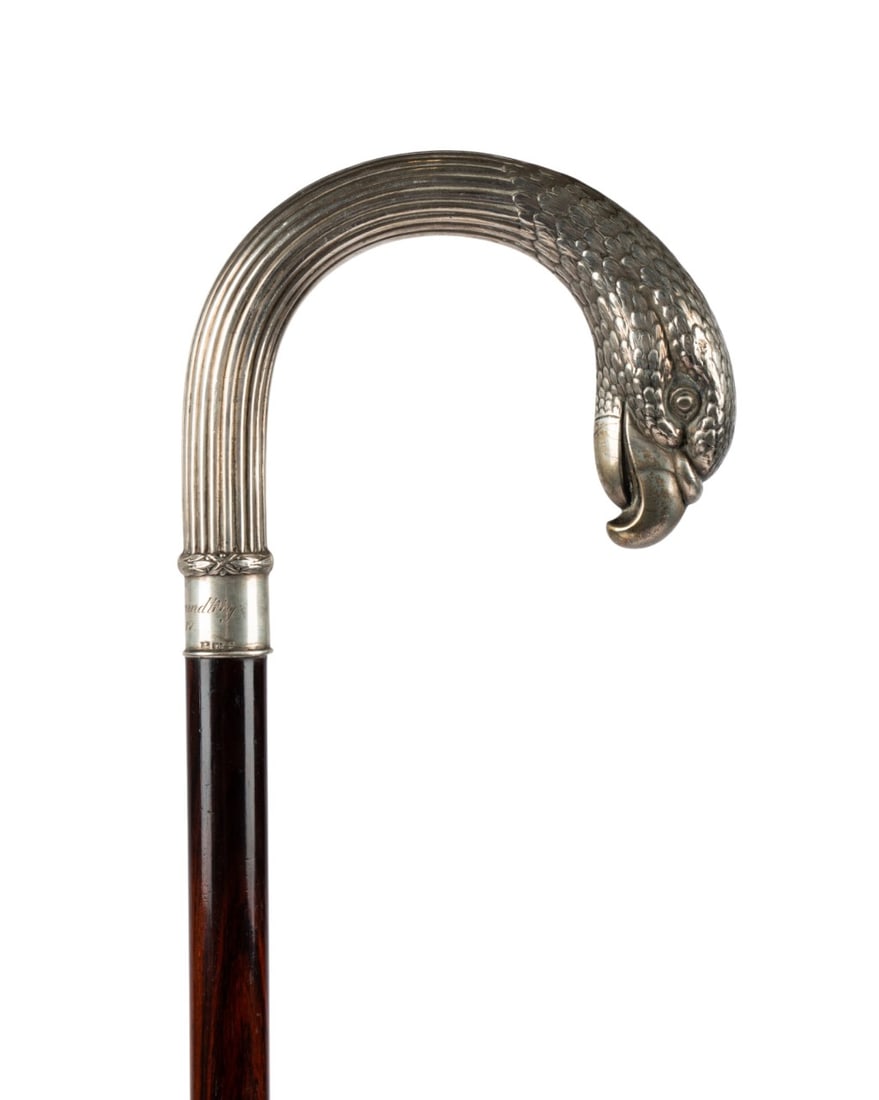 GERMAN SILVER EAGLE WALKING CANE, 1917: German, 1917. Walking cane with ornate silver fluted crook handle terminating in eagle?s head, silver collar engraved ?Svend Grundtnig 4-7-17? with Continental silver marks on rim, with rosewood shaft