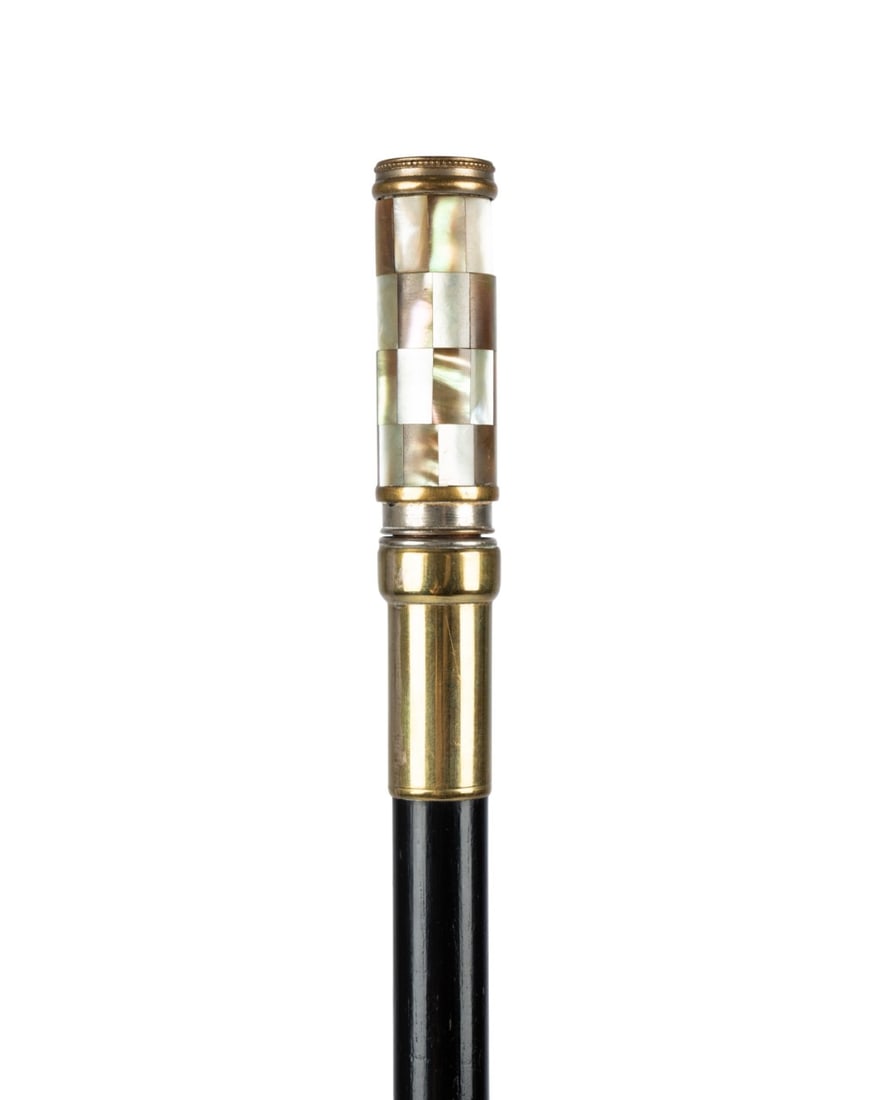 FRENCH PERFUME ATOMIZER LADIES CANE, C. 1895: French, circa 1895. Walking cane with brass and mother of pearl handle functioning as perfume atomizer, twisting to extend and pump perfume from top, seated on brass collar, with ebonized hardwood sha