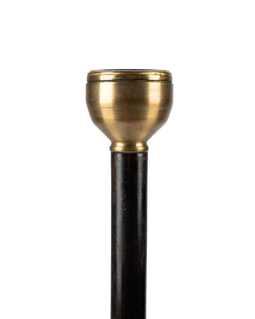 19TH C. SALANSON & CO BAROMETER GADGET CANE: English, circa 1880. Gadget walking cane with barometer handle by H. Salanson & Co, glass-covered white face set in solid brass holder, mounted on ebonized hardwood shaft terminating in long horn ferr