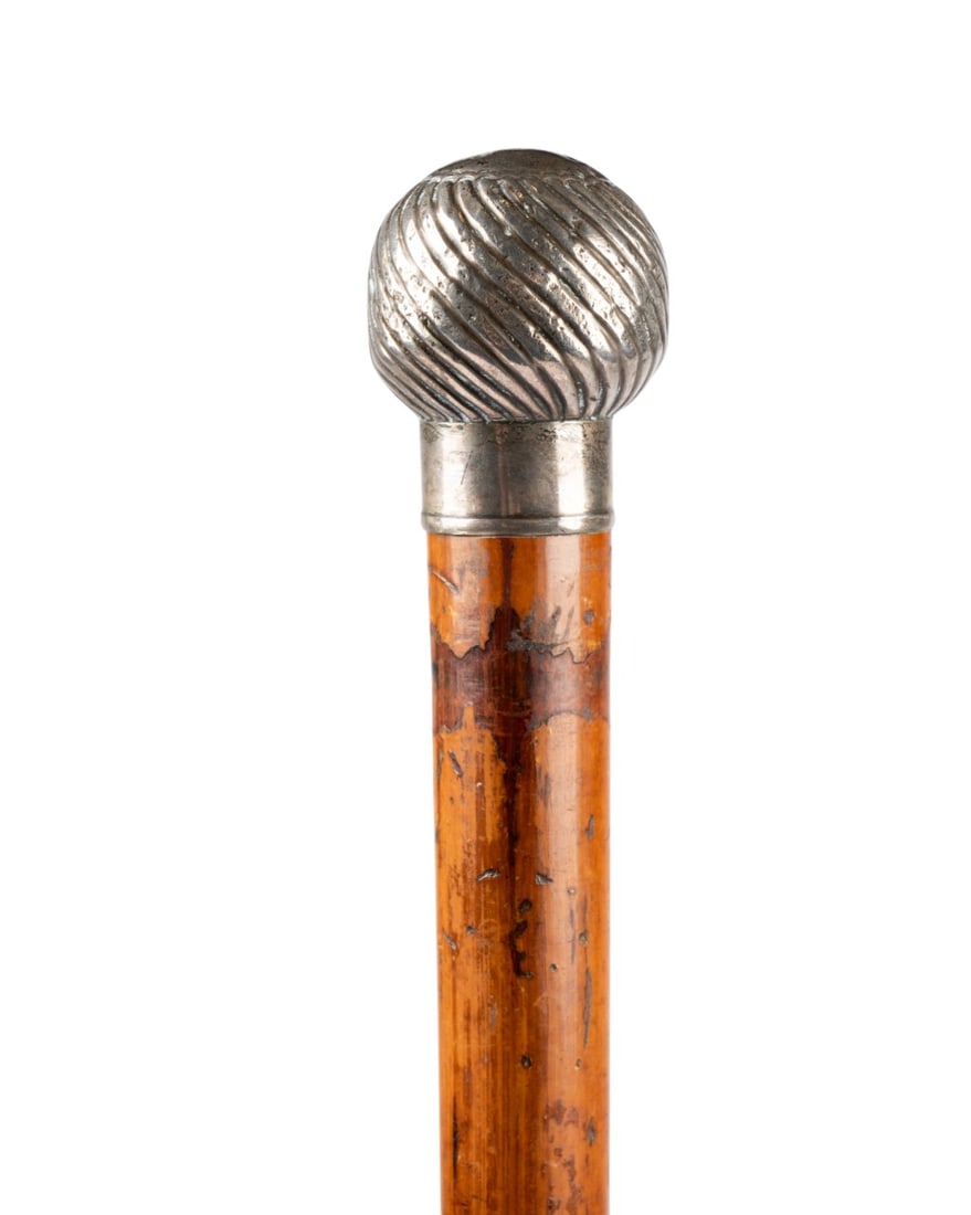 ENGLISH SILVER SEAL WALKING CANE, C. 1890: English, circa 1890, Ebenezer Newman & Co. (British, founded 1883). Seal walking cane with silver top, unscrewing to reveal lead monogram "PSC" for wax seals, with Malacca wood shaft terminating in ho