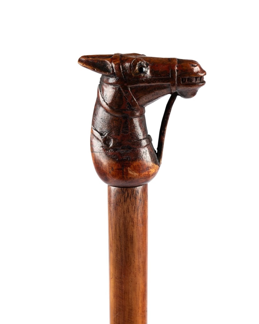 19TH C. ENGLISH ARCHITECT'S GADGET CANE: English, circa 1870. Architect’s gadget walking cane with carved red oak horse head handle with glass eyes and carved bridle, Malacca shaft with silver band engraved “IOC,” handle