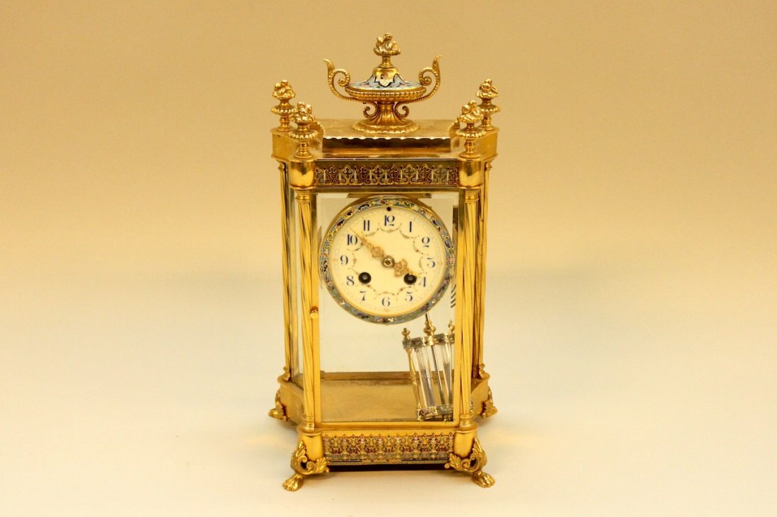 French Cloisonne Mari Bronze Dore Regulator Clock: Case & pendulum enameled. Fine decorated porcelain face. In working condition. Marked "Medaille de Bronze" and Marti. Measures 15" tall, 9" wide, and 6" deep.