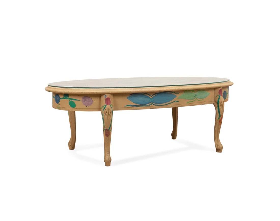 MOSE TOLIVER, SIGNED FLORAL PAINTED OVAL TABLE: Mose Tolliver (American, 1919-2006). Untitled - Floral Motif Oval Coffee Table, house paint on found wood table, signed "Mose T" to edge of top. Accompanied by a glass top. Provenance: Private Collect