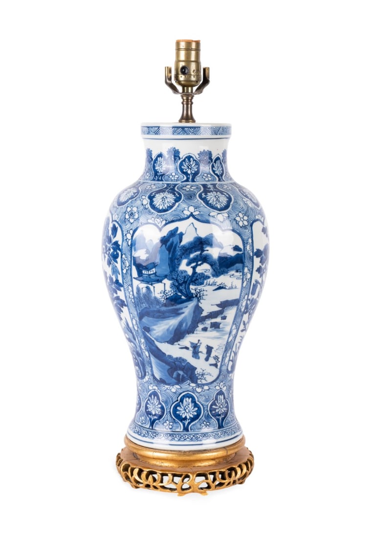 CHINESE BLUE AND WHITE GILT BASE TABLE LAMP: Chinese. Blue and white porcelain vase converted to a lamp, decorated in a traditional bird and flower design of the 18th century. With gilt base. Provenance: Estate of Scott Hudgens and Jacqueline Ca