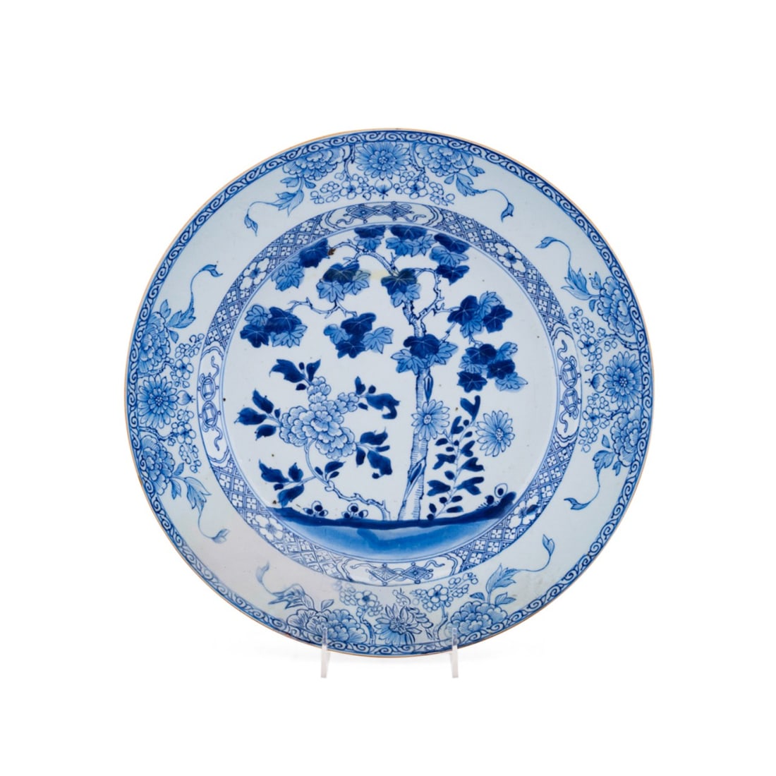 CHINESE EXPORT BLUE AND WHITE CHARGER: Chinese, 18th century. Chinese Export round blue and white charger decorated with a tree and flowering branches at the base, floral sprays around the rim, apparently unmarked. Provenance: Estate of