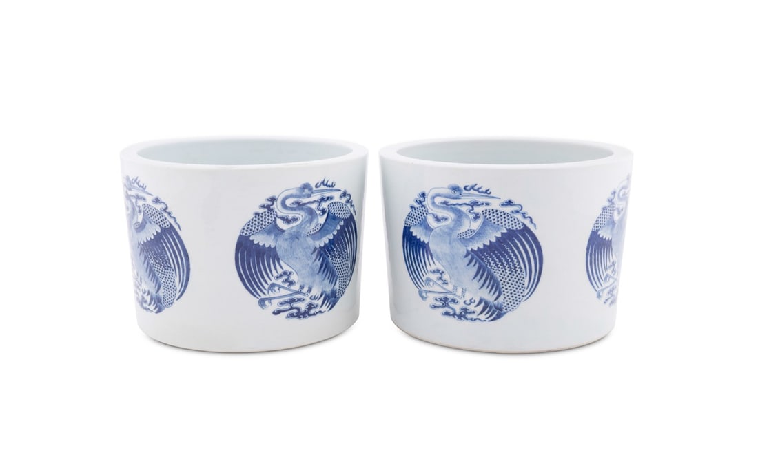 PAIR OF CHINESE BLUE AND WHITE JARDINIERES: Chinese, 20th century. Pair of blue and white porcelain planters featuring bird medallions, apparently unmarked. Provenance: Estate of Scott Hudgens and Jacqueline Casey Hudgens, Duluth, GA. 