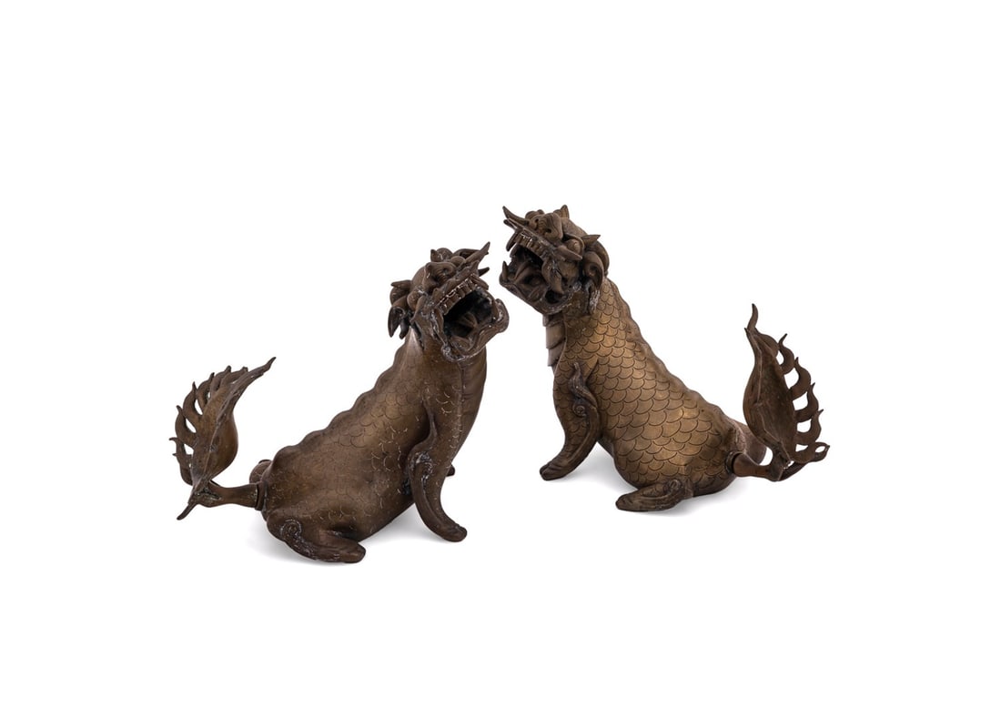 PAIR OF CHINESE BRONZE MYTHICAL PIXIU: Chinese, 19th century. Pair of roaring bronze guardian creatures or mythical pixiu with open mouths and upturned tails, likely guarding a palace entrance way, apparently unmarked. Provenance: Estate