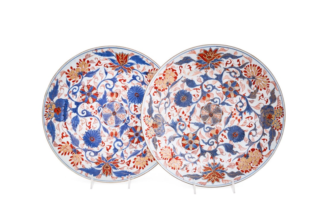 PAIR OF CHINESE QIANLONG PERIOD IMARI CHARGERS: Chinese, Qianlong period, 18th century. Pair of Chinese Export Imari porcelain chargers in underglaze blue, iron red and gilt on white, and with scrolling vine and flower design, character mark to