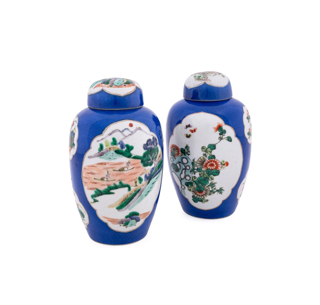 PAIR CHINESE FAMILLE VERTE LIDDED JARS: Chinese, late 19th / early 20th century. Pair of Famille Verte porcelain jars with powder blue ground, floral reserve panels, and dome lids, apparently unmarked. Provenance: Estate of Scott Hudgens an