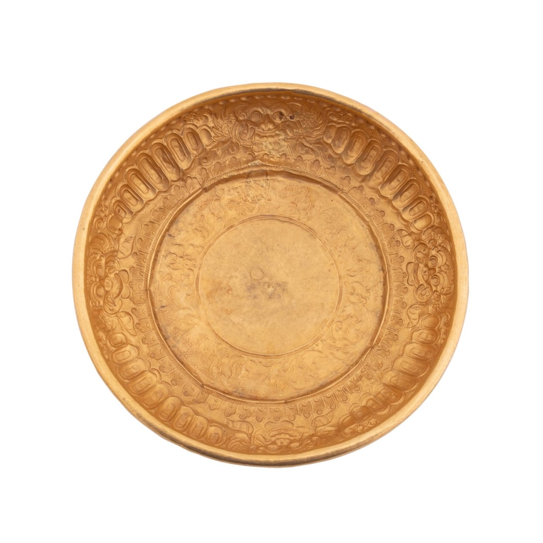 INDONESIAN GOLD REPOUSSE BOWL W/ LION MASKS: Southeast Asian. Indonesian (Javanese) gold repousse bokor / offering bowl, with a foliate motif and lion mask border and brass ring under rolled rim, apparently unmarked. Provenance: The Estate of Ed