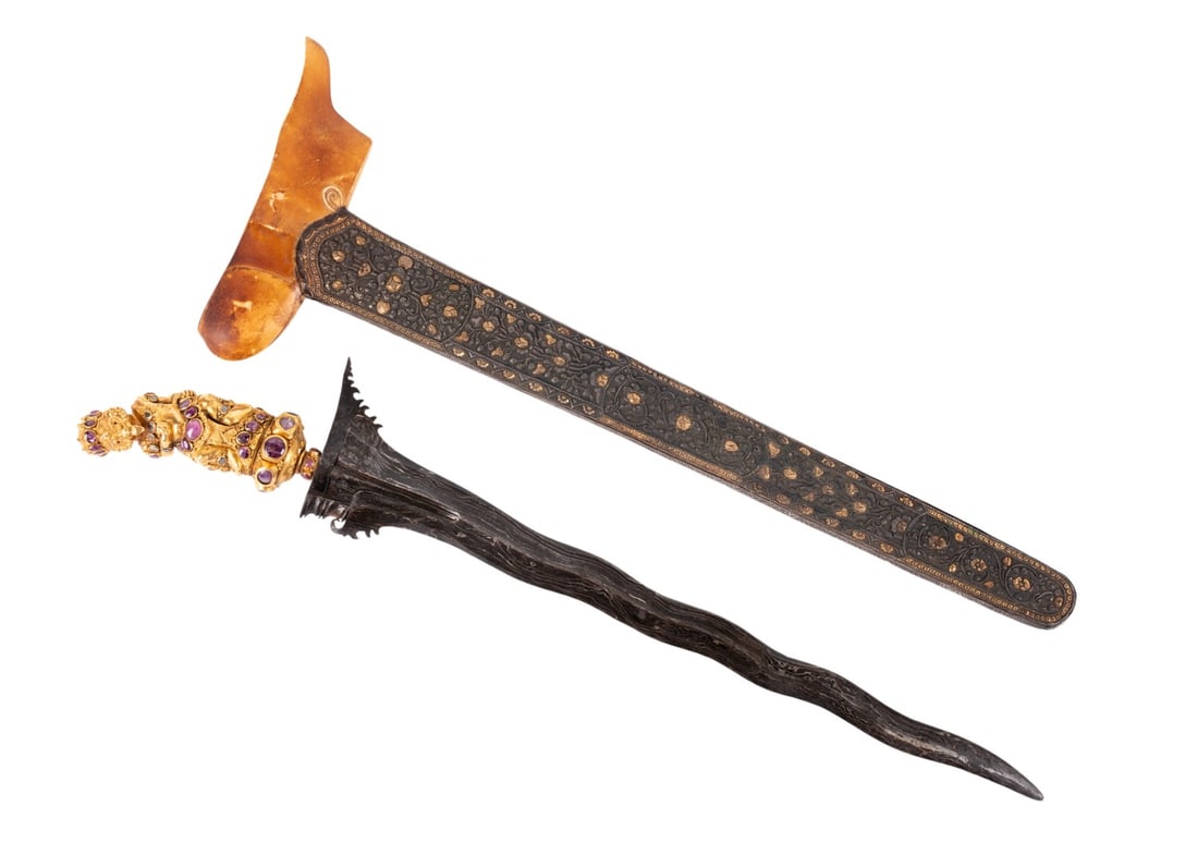 UNIQUE INDONESIAN KRIS W/ BONE, GOLD, AND SILVER: Southeast Asian, 20th century. Unique Indonesian Kris having carved bone wrangka, with a dark amber patina; ruby, sapphire, and diamond cabochon mounted gold anthropomorphic deity hilt, and a silver r