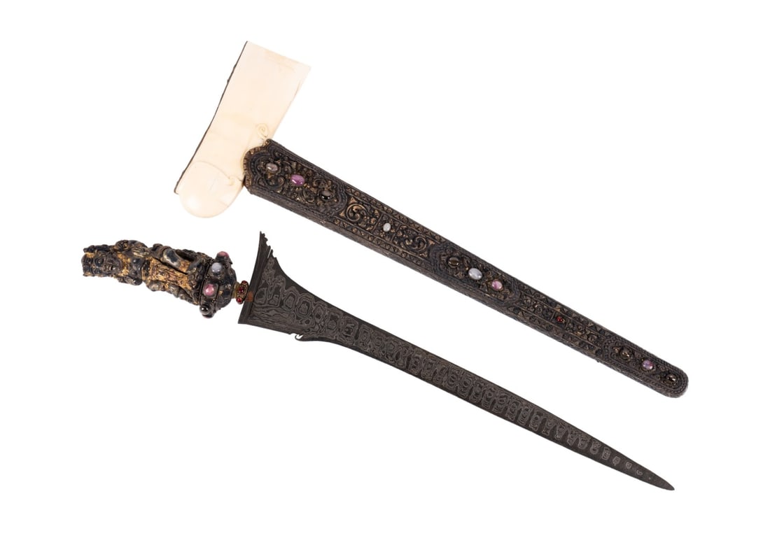 BALINESE SILVER GILT GEM SET KRIS W/ BONE WRANGKA: Southeast Asian. Balinese silver gilt semi-precious cabochon set Kris / Keris with anthropomorphic deity hilt, carved bone wrangka, and silver gilt wrapped sheath, apparently unmarked. Note: Ahlers &