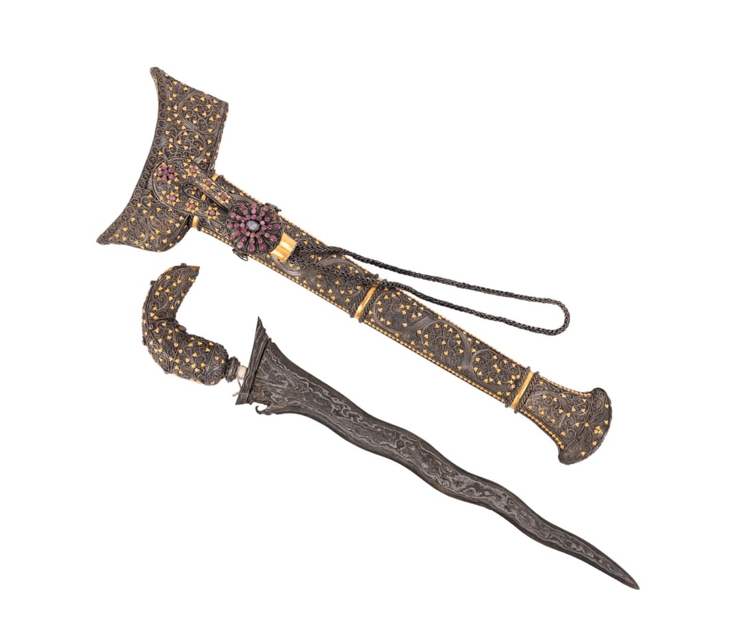 INDONESIAN SILVER/GOLD INSET KRIS, IVY FILIGREE: Southeast Asian. Indonesian silver gilt Kris / Keris having an ivy motif silver and gilt filigree stylized bird form hilt, ferrule, and scabbard, and accented with a ruby and sapphire cabochon