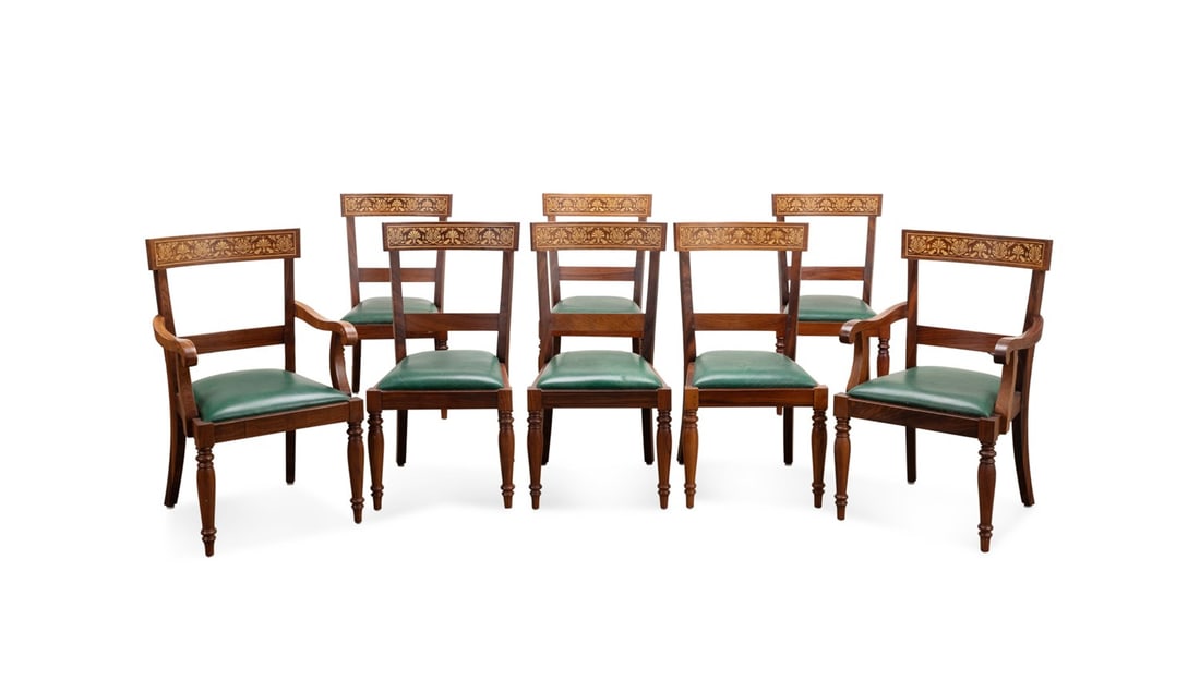 8 ANGLO-INDIAN ROSEWOOD & LEATHER DINING CHAIRS: Anglo-Indian, 20th century. Set of eight Edwardian style rosewood dining chairs, with a floral mixed wood inlaid top rail, green leather upholstered seat, and raised on front turned legs, apparently u