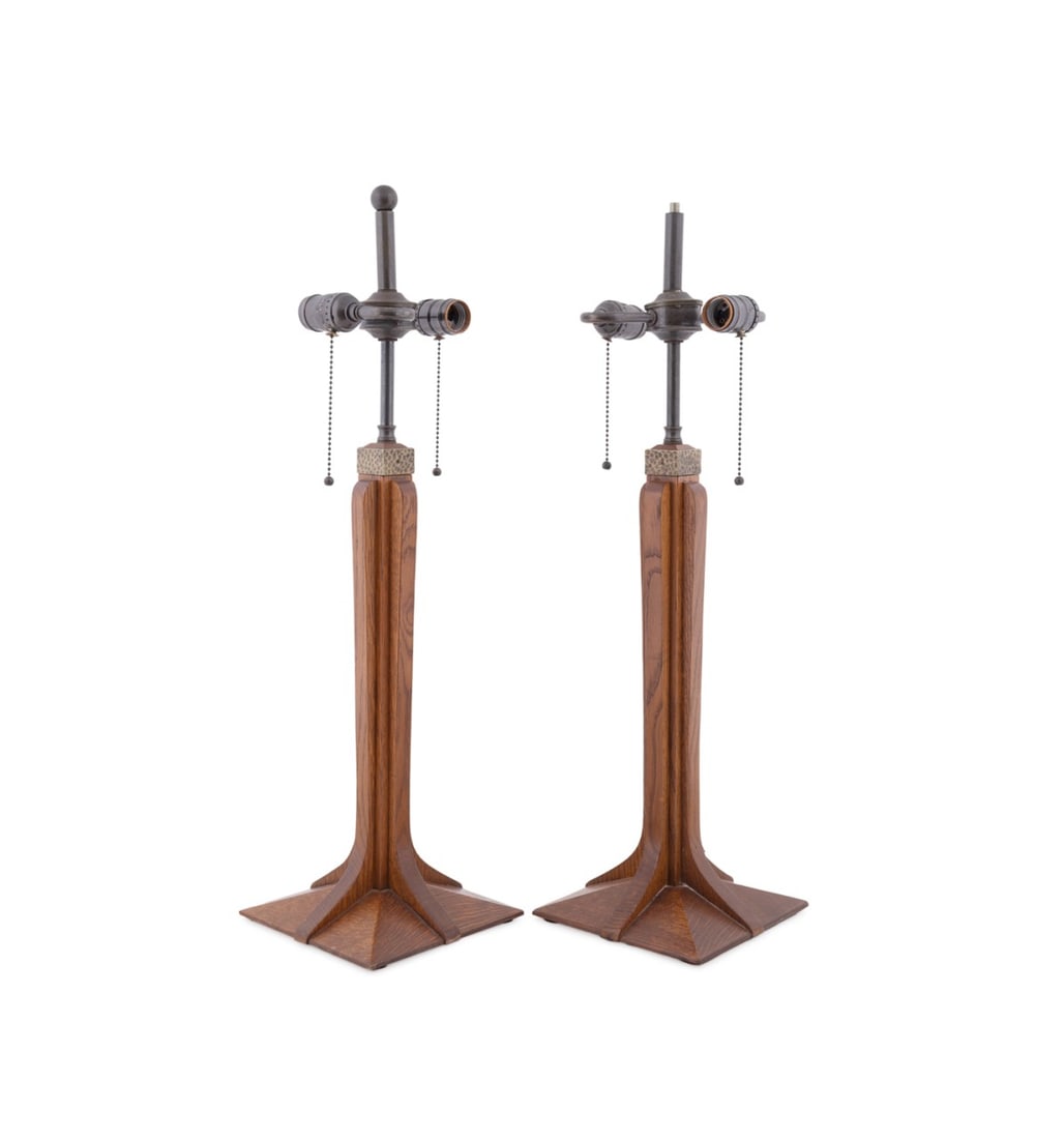 L. & J.G. STICKLEY, PAIR OF 'CORBEL' TABLE LAMPS: L. & J.G. Stickley (American, founded 1900), 2000. Pair of oak "Corbel" (model number 8932) table lamps in the Arts & Crafts taste, each having a Fayetteville finish (finish number 35), 2-lights, hamm