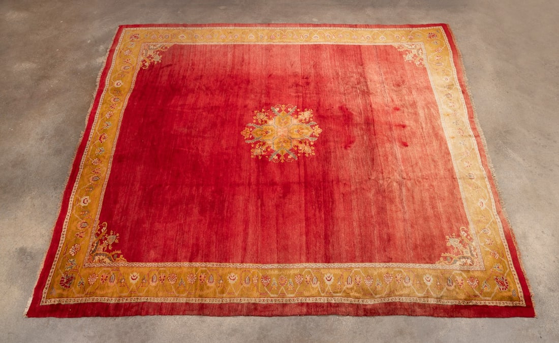 TURKISH 20TH C. LARGE HANDWOVEN OUSHAK, RED/GOLD: Turkish, 20th century. Large handwoven Oushak rug having a bright red field with gold and salmon accents. Provenance: Estate of Scott Hudgens and Jacqueline Casey Hudgens, Duluth, GA. Approximate dime