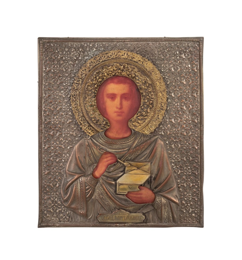 19TH C. RUSSIAN ORTHODOX SAINT PANTELEIMON ICON: Russian, 19th century. Russian Orthodox "Saint Panteleimon" icon, chromolithography, stamped silver oklad or riza with Church Slavonic, stamped with unidentifiable maker's mark, assayer's mark, and ci