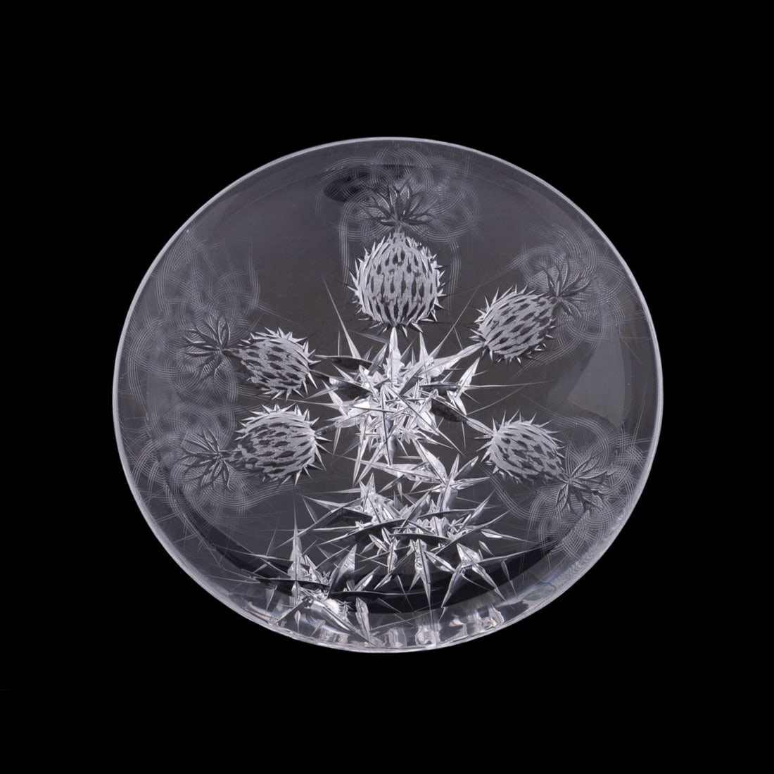 JOSEF SVARC SHALLOW CUT GLASS THISTLE TRAY: Josef Svarc (Czech, 1928-2016). Scottish Thistle cut glass tray with intaglio cut pattern on reverse, apparently unmarked. Approximate dimensions: h. 1.5", diam. 8.5".