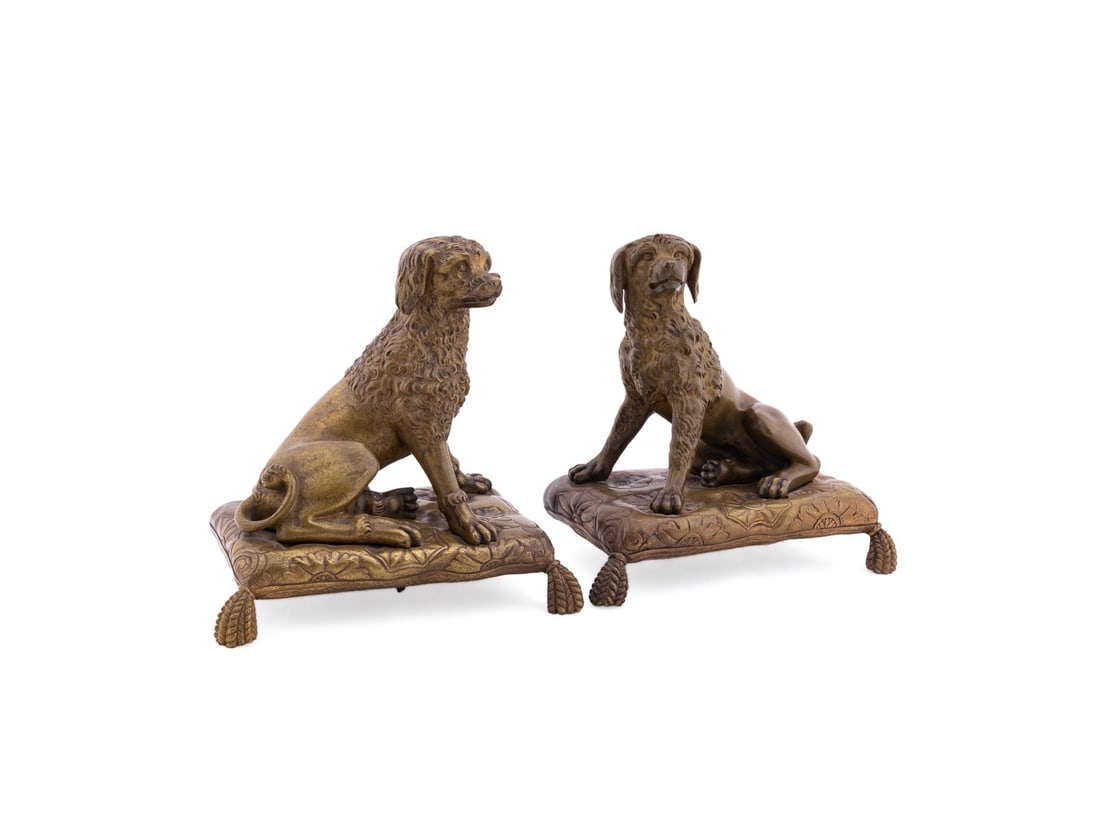 PAIR OF EUROPEAN BRONZE DOG BOOKENDS: European, 19th / 20th century. Pair of bronze bookends or figures, each modeled as a seated dog on a cushion, both apparently unmarked. Provenance: Estate of Scott Hudgens and Jacqueline Casey Hudgens