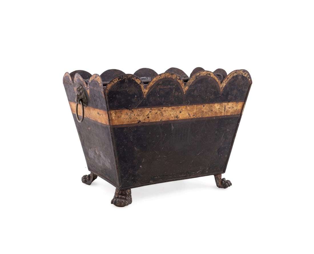 19TH/20TH C. FRENCH TOLE JARDINIERE OR LOG CADDY: European, possibly French, 19th / 20th century. Black painted tole jardiniere or log caddy having a scalloped edge, and gold painted bands, and rising on brass paw feet, apparently unmarked. Provenanc