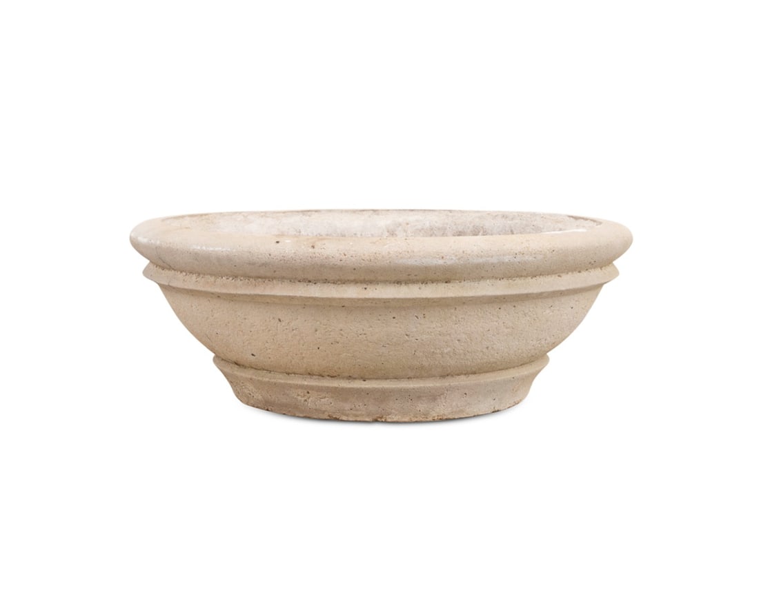 LARGE CAST STONE OUTDOOR GARDEN PLANTER: Likely American, 20th century. Large circular cast stone garden planter, apparently unmarked. Approximate dimensions: h. 11.75", dia. 32.5".