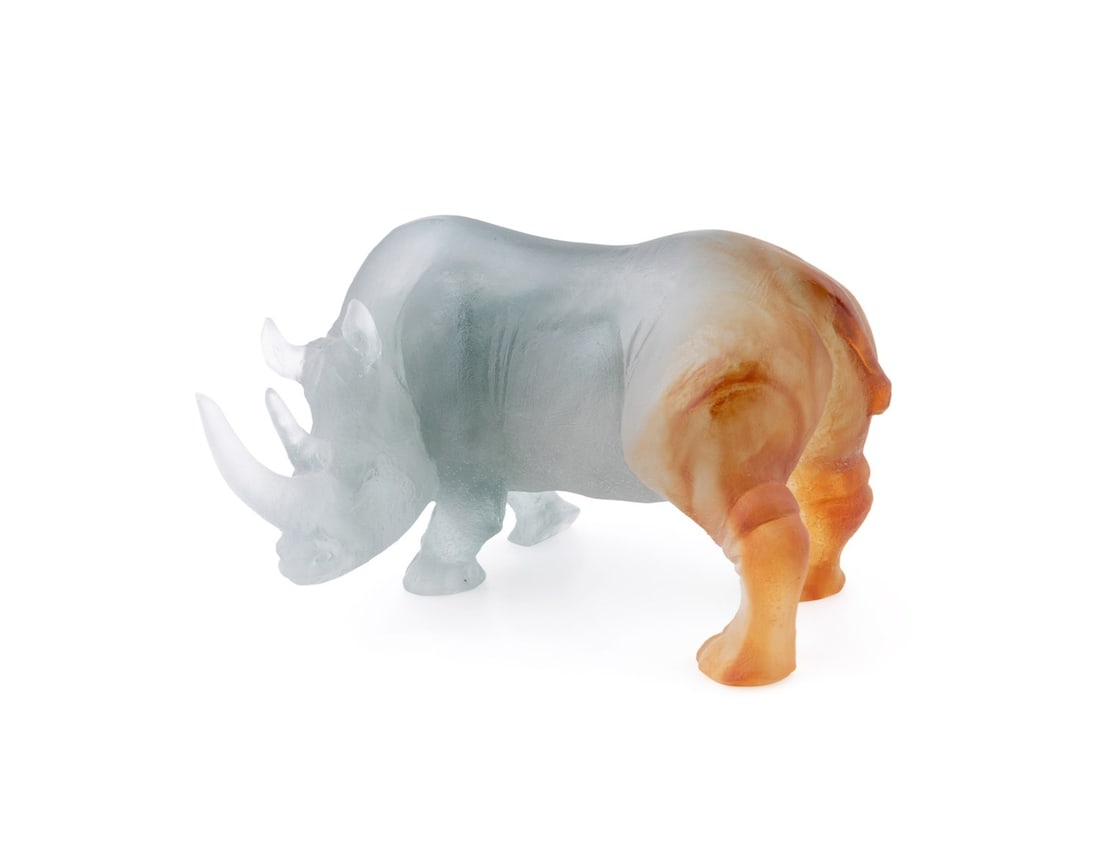 DAUM, PATE DE VERRE RHINOCEROS SCULPTURE: Daum (French, founded 1878). Gray to amber pate de verre rhinoceros, acid-etched signature " Daum France" to underside of the front right foot. Provenance: Private Collection of an Esteemed Gentleman,