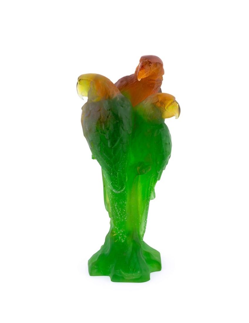 DAUM, LIMITED EDITION MACAW SCULPTURE: Daum (French, founded 1878). Limited edition pate de verre green and amber macaws on a branch, acid-etched signature "Daum France" and numbered "61" to the bottom of the statue. Provenance: Private Co