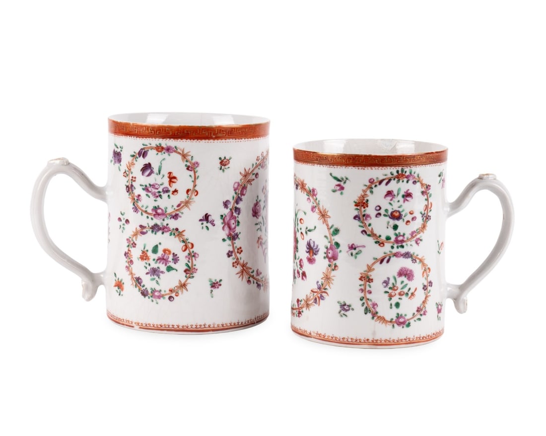 TWO CHINESE EXPORT PORCELAIN HANDLED MUGS: Chinese, mid to late 18th century. Chinese Export porcelain mugs, having Famille Rose palette with floral sprays of magenta, purple roses and other flowers with flying bow knots depicted in circular a