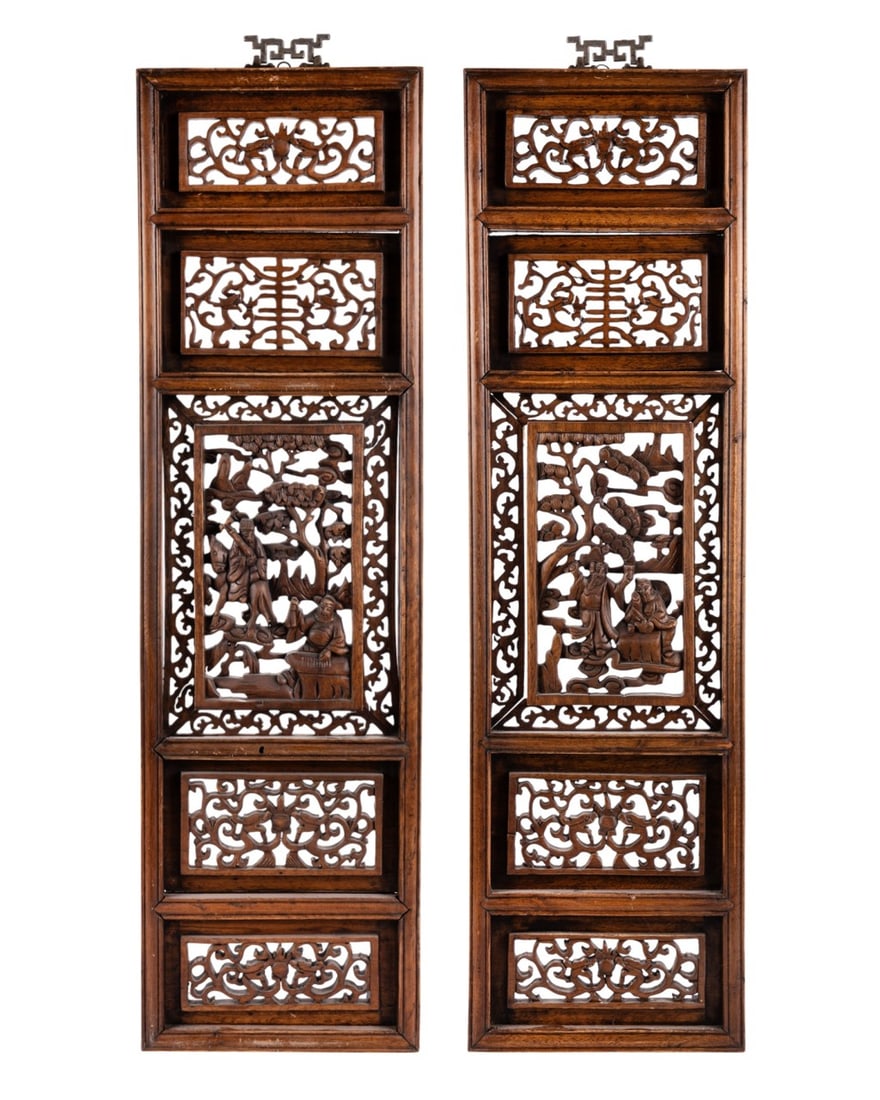 PAIR OF CHINESE ELM WOOD CARVED PANELS: Chinese, early 20th century. Pair of elm wood carved panels featuring intricate open-work designs of figures and flowers from eastern China, with decorative silver hanging hooks. Provenance: Private C