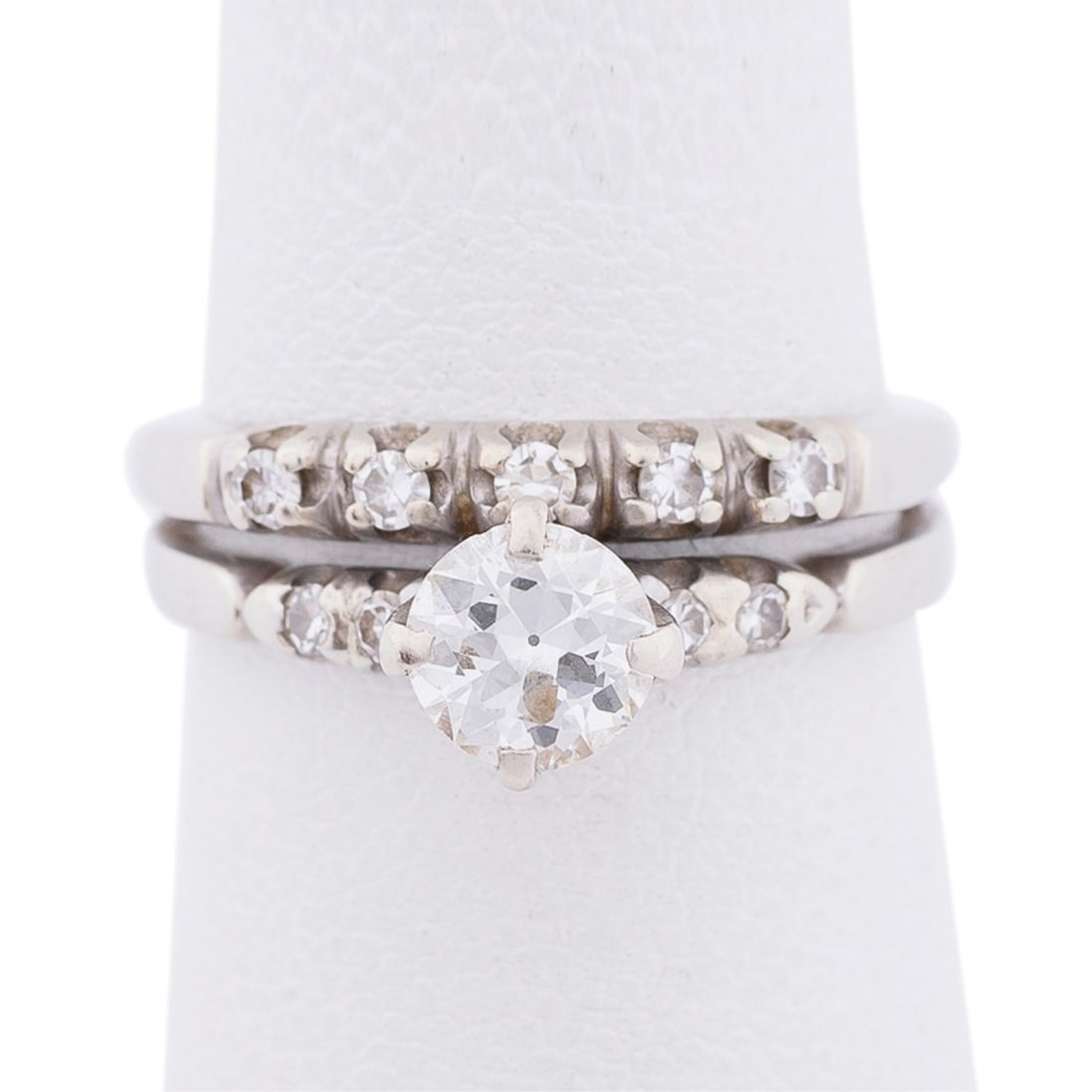 DIAMOND & 14K WHITE GOLD WEDDING SET: Diamond wedding set (2 rings soldered together) in 14K white gold featuring round brilliant cut diamond weighing approximately 0.75 total carats (5.3 x 5.3 x 4.4mm) and (2) round brilliant and (5) rou