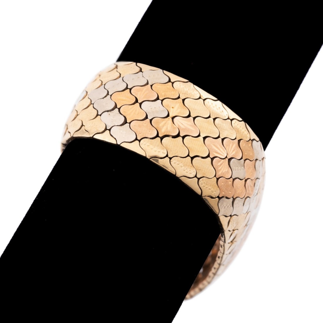 ITALIAN 18K TRI-COLOR GOLD WIDE BRACELET: Italian wide articulated fancy link 18k tri-color gold bracelet. Stamped 18k and city mark to back of clasp. Approximate dimensions: l. 8.125", w. 0.875", clasp d. 0.125"; total weight 62.3 grams. Not