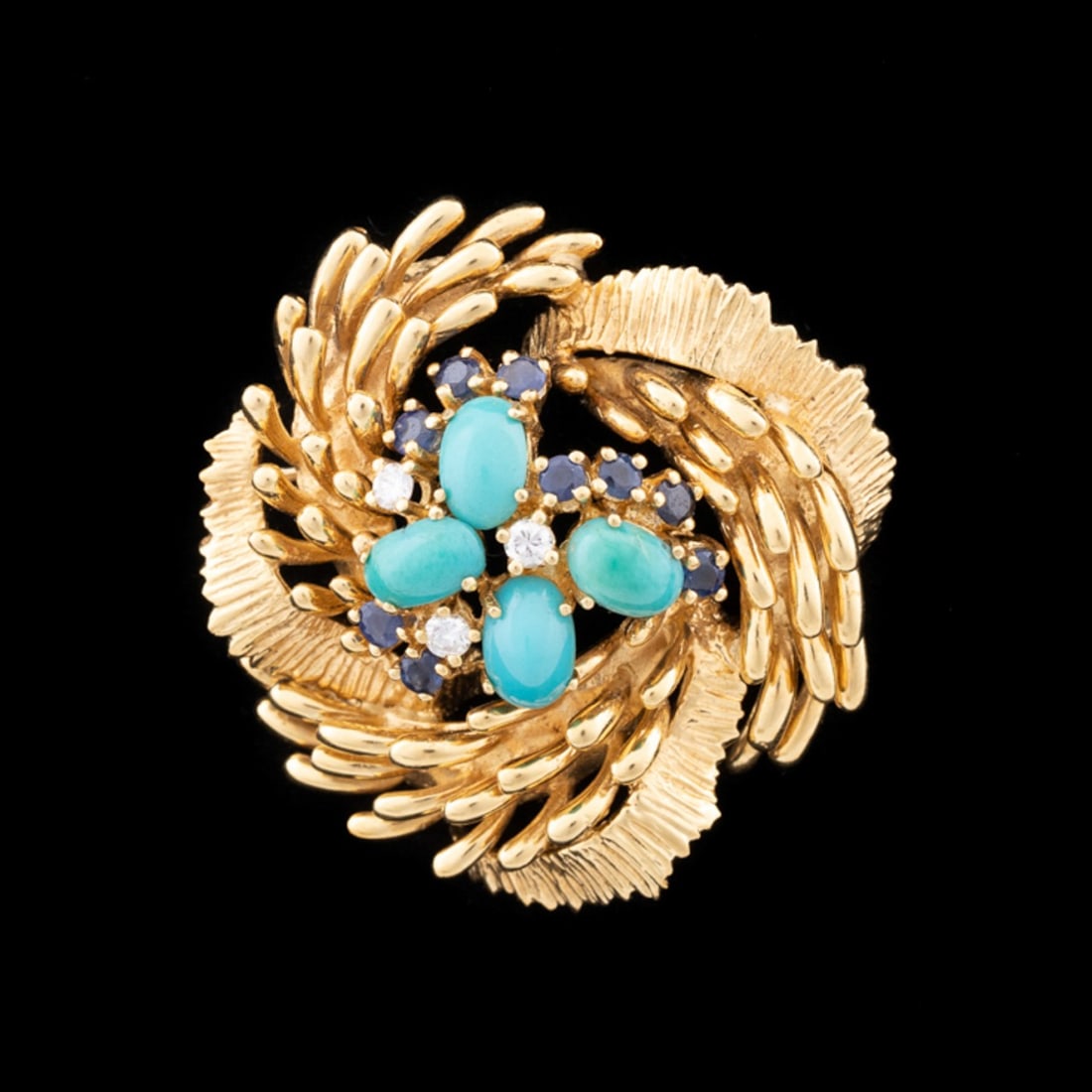 CELLINO TURQUOISE, SAPPHIRE, DIAMOND & 18K BROOCH: Cellino (Italian, founded 1970's). Round gold brooch centering on four oval cabochon turquoise (approximately 6.5 x 4.5x 3.5mm), (3) round brilliant cut diamonds, and (9) round cut sapphires, diamond