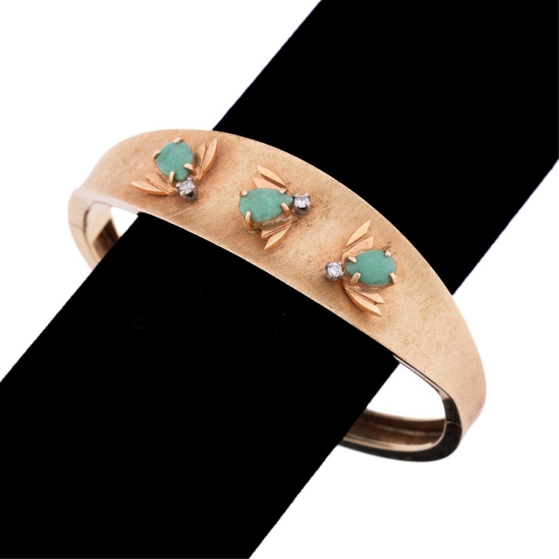 JADE AND DIAMOND BEE MOTIF BANGLE BRACELET, 14K YG: Jade and diamond bangle bracelet featuring (3) pear shape light green translucent jade tablets set in shape of three bee motif accents with (3) round brilliant cut diamond heads weighing approximately