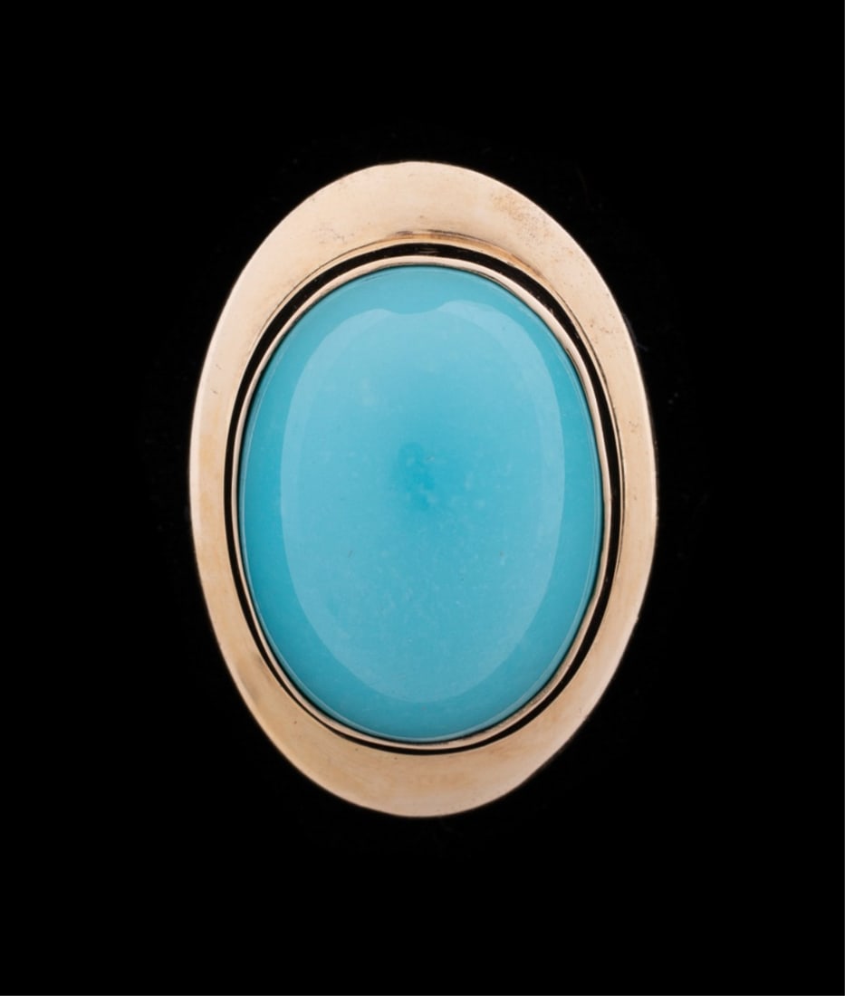 TURQUOISE & 14K YELLOW GOLD SLIDE PENDANT: Turquoise slide pendant featuring an oval cabochon turquoise measuring approximately 20.0 x 15.0mm, bezel set in polished yellow gold slide pendant. Tested as 14K. Approximate dimensions: l. 1.125", w