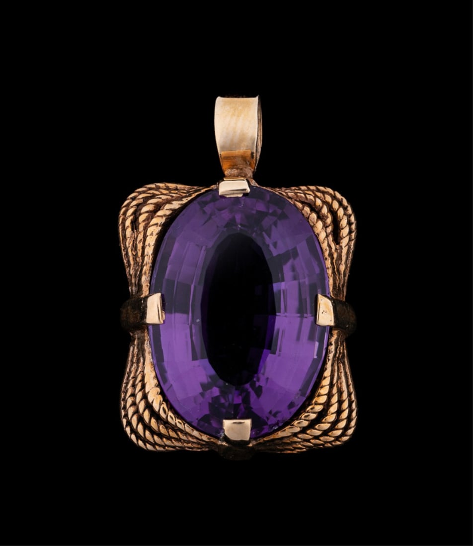 AMETHYST & 14K YELLOW GOLD PENDANT: Amethyst pendant featuring an oval faceted amethyst weighing approximately 10.00 total carats, set in yellow gold rope twist design pendant. Tested as 14K. Provenance: Private Collection, Atlanta, GA.