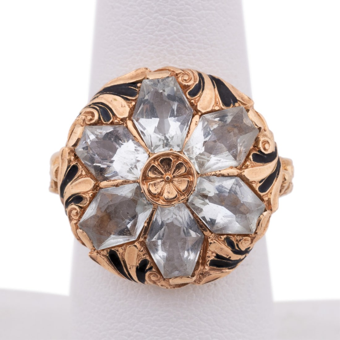 AQUAMARINE, ENAMEL & 14K YELLOW GOLD RING: Aquamarine, enamel and 14k yellow gold ring featuring (6) mixed antique cut aquamarines weighing approximately 0.50 total carats in flower formation in foliate design setting with black enamel accenti