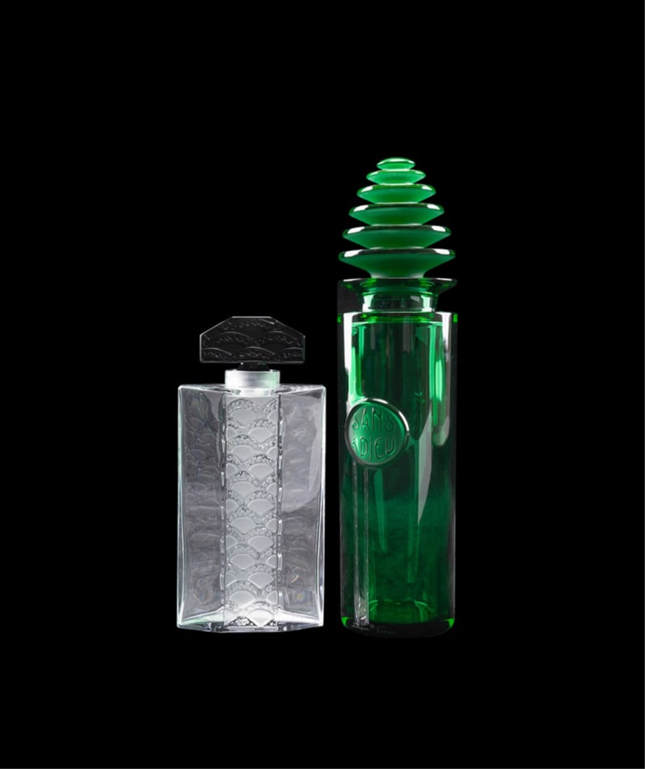 LALIQUE, "SANS ADIEU" AND "EPIS" SCENT BOTTLES: Lalique (French, founded 1888), late 20th to early 21st century. Group of two crystal perfume or scent bottles comprising, for the House of Worth (French, 1858-1956) a large green "Sans Adieu" bottle