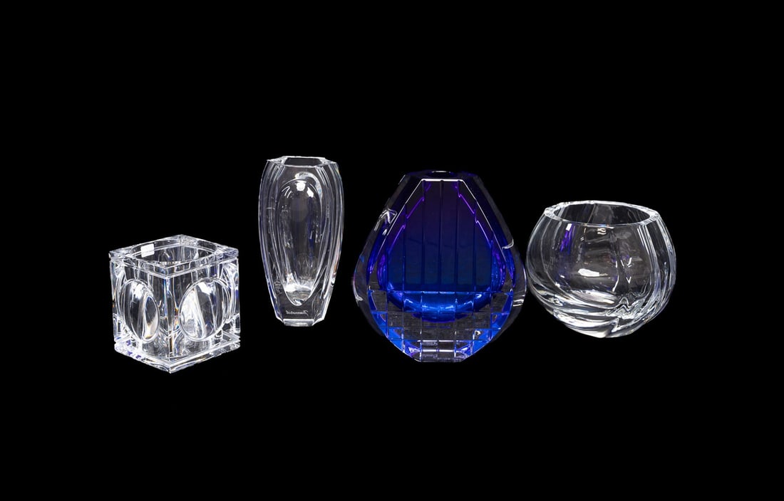 BACCARAT, FOUR TABLE ARTICLES INCL. BLUE "NEPTUNE": Baccarat (French, founded 1764), late 20th to early 21st century. Group of four modern colorless crystal table items comprising, a blue "Neptune" vase, a "Bouton D'Or" vase, an "Elysee" vase, and a Th