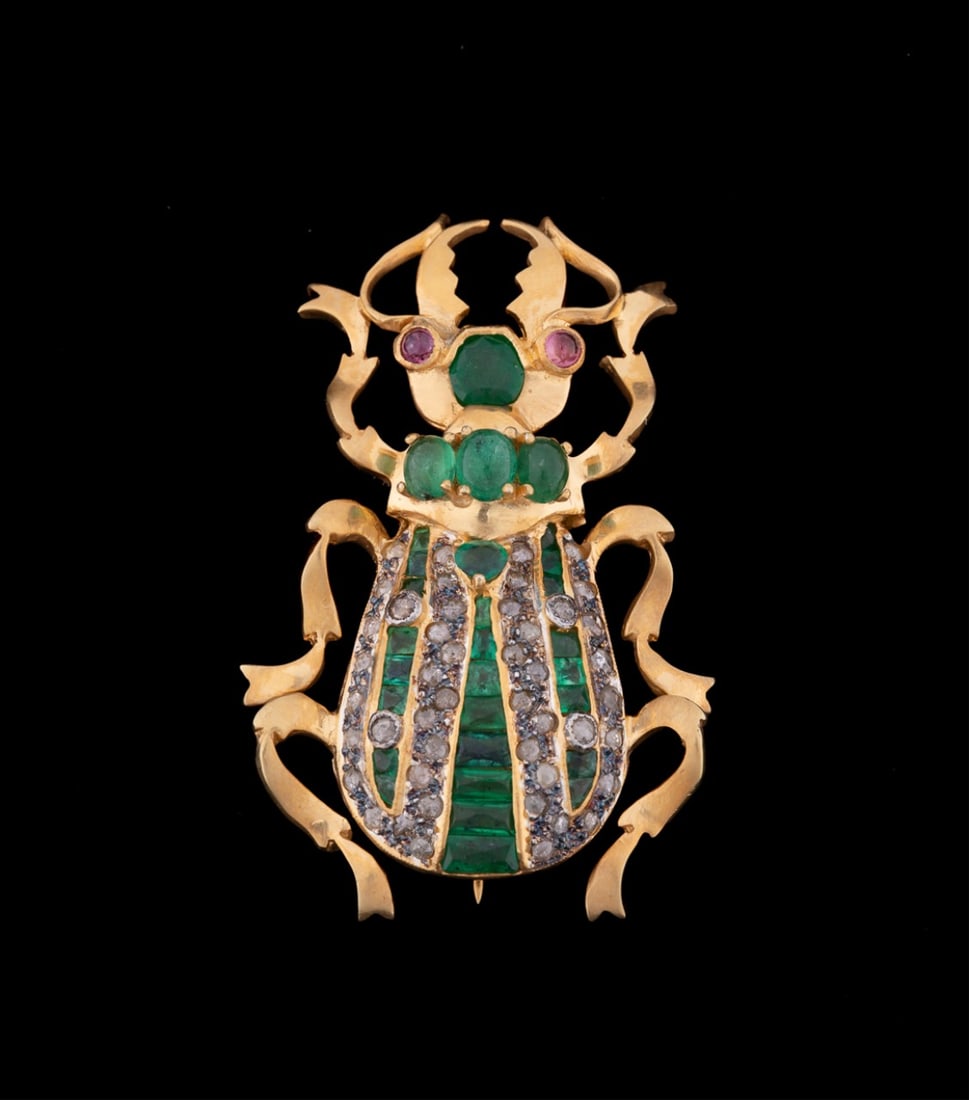 EMERALD, DIAMOND, AND RUBY BEETLE BROOCH/PENDANT: Emerald, ruby, and diamond beetle brooch / pendant featuring (27) light green emeralds weighing approximately 3.00 total carats, (46) rose cut diamonds weighing approximately 1.00 total carats, (2) pi