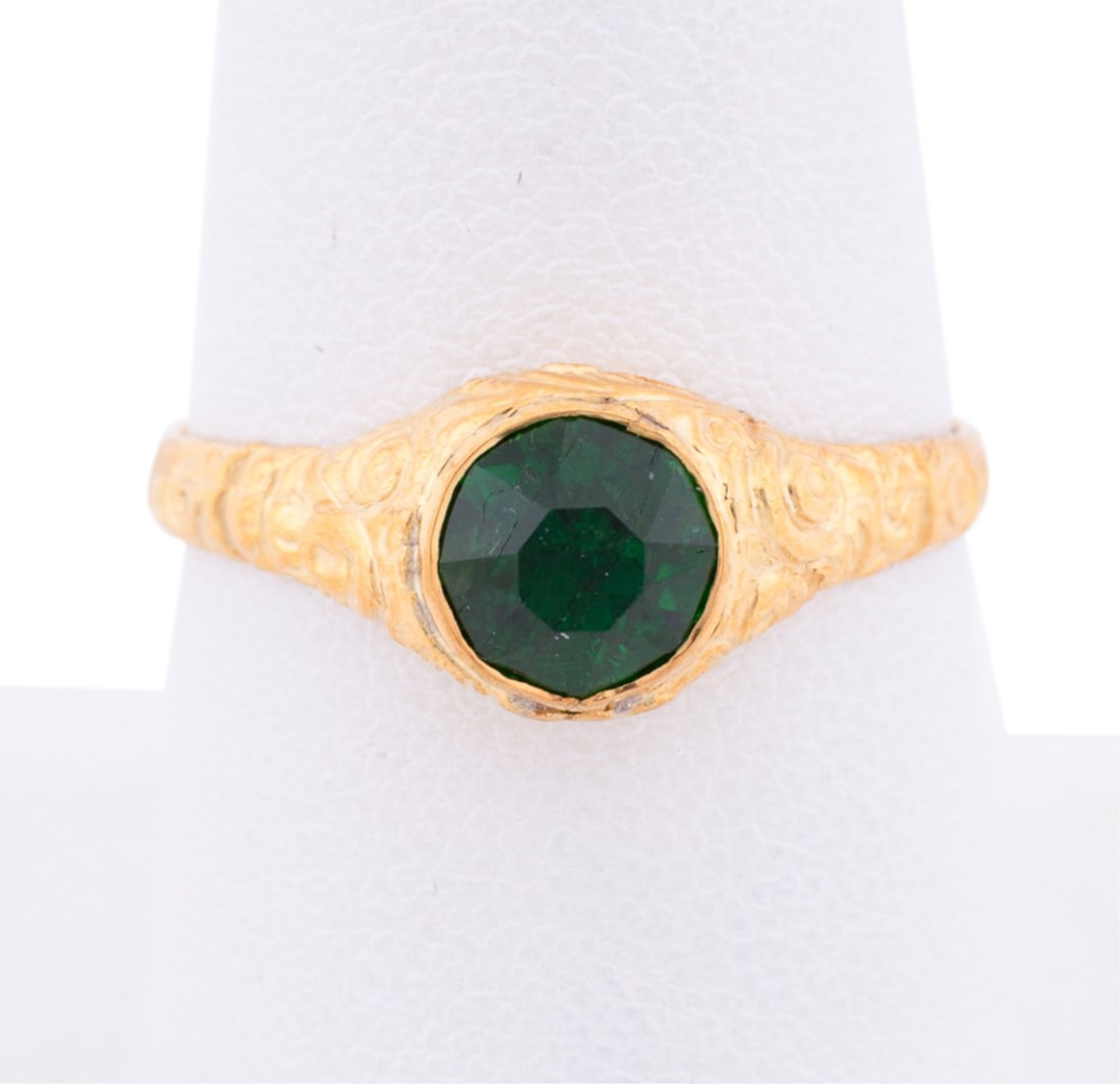 VICTORIAN STYLE CHROME TOURMALINE GOLD RING: Victorian style tourmaline ring featuring (1) round shape chrome tourmaline weighing approximately 1.20 total carats set in 9K gold and silver gilt accented with floral carvings. Marked 925 and 375. A